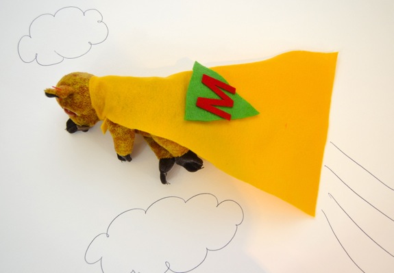 Create a super hero cape for stuffed animals.